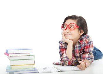 16574292 - asian little girl  thinking  during preparing homework